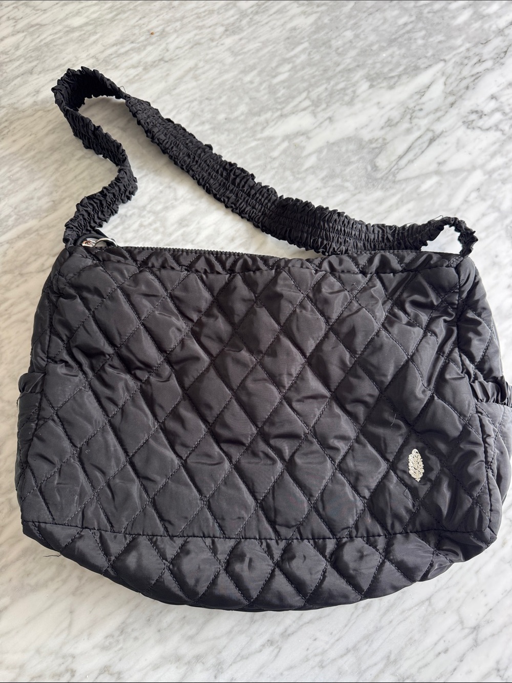 Free People black quilted large elastic gathered strap zipper close bag.